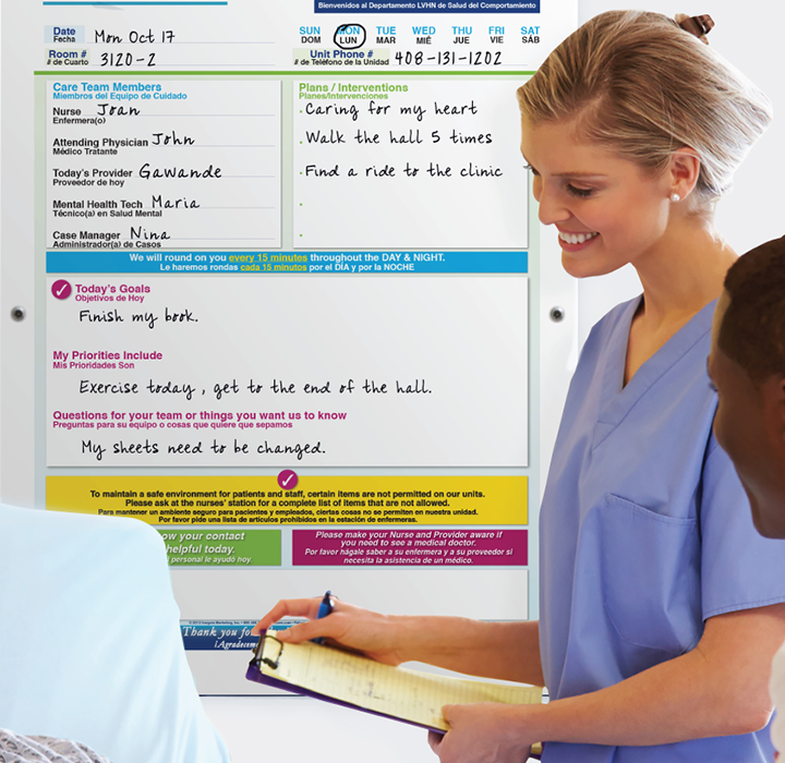 behavioral health patient & nurse in patient room with safety whiteboard