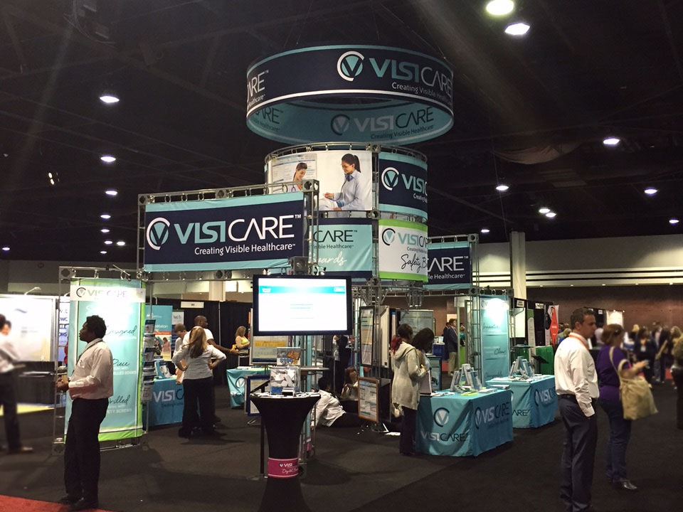 VisiCare Custom White Board Conference Booth display and tables