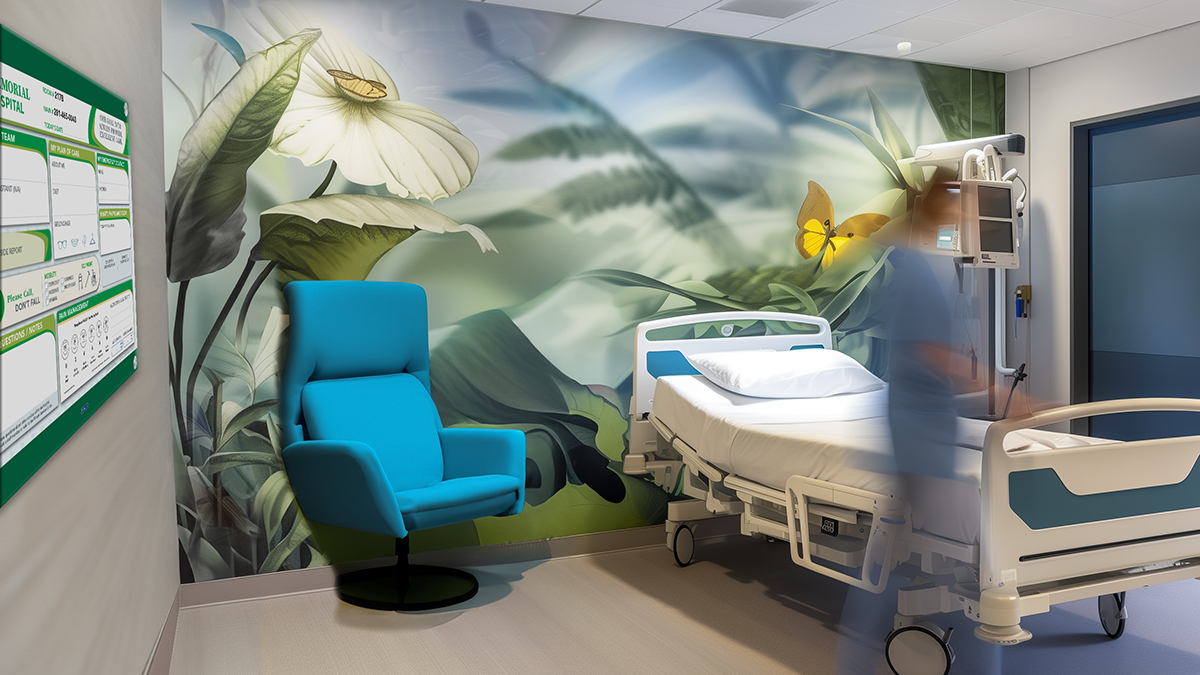 Nurse in patient room with mural and custom patient information board