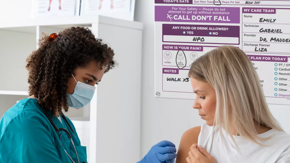 Nurse and patient with custom glass clear whiteboard in direct print board style