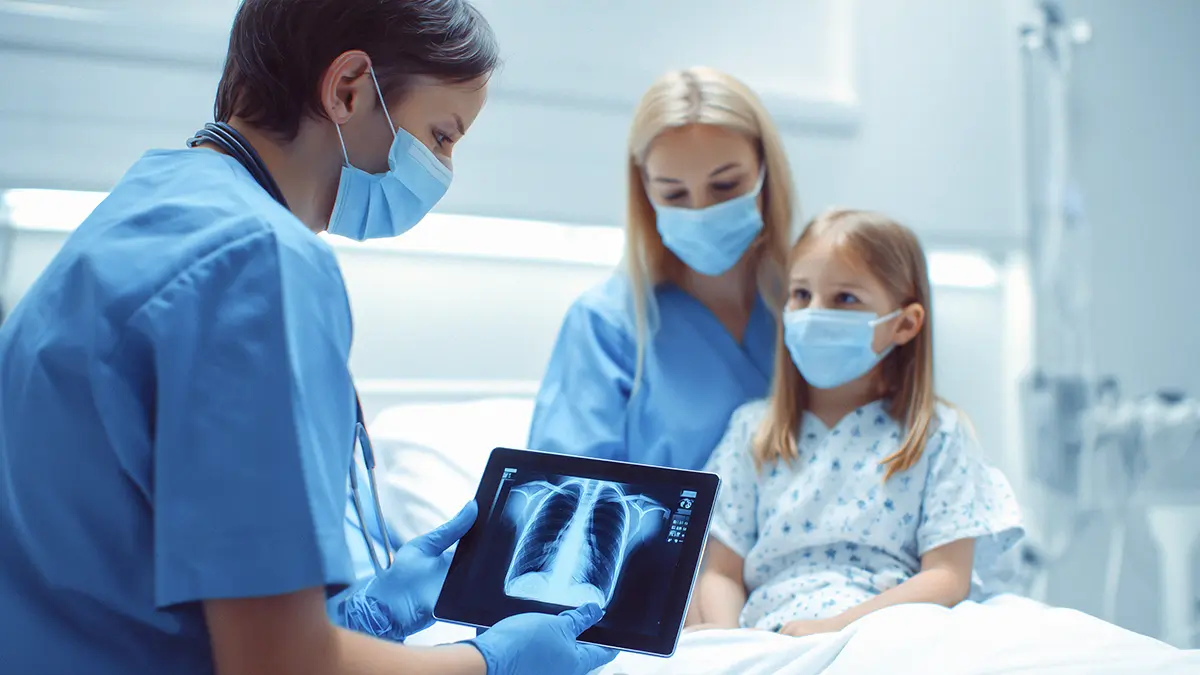 nurse educates a patient and caregiver on care plan