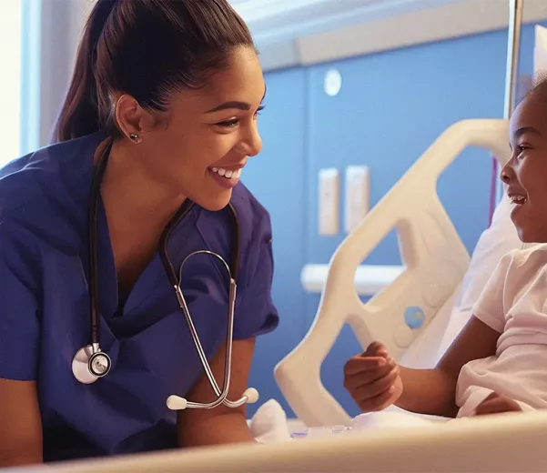 Nurse and patient in pediatric hopsital room with custom healthcare patient whiteboard