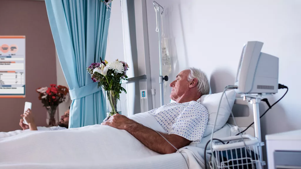 patients in modern patient room with custom patient board