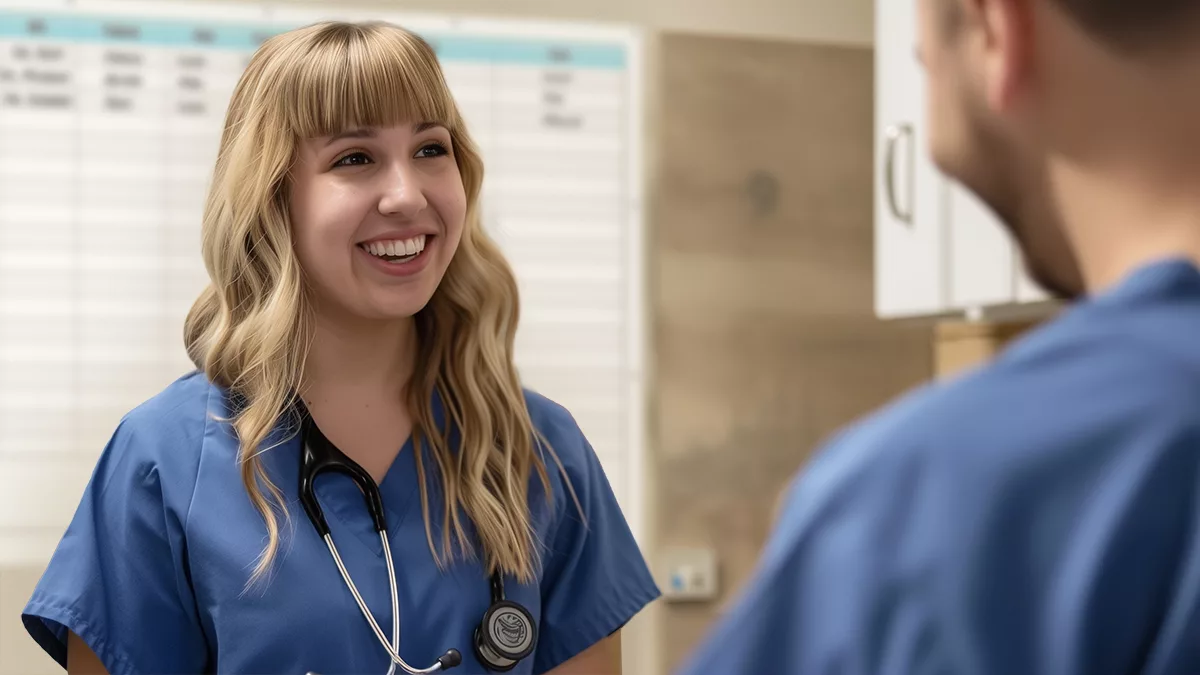 Nurses discuss care in nurse unit with custom safety board