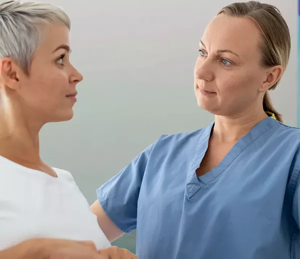 Nurse and patient in behaviorial health space with custom VisiCare Safety Board