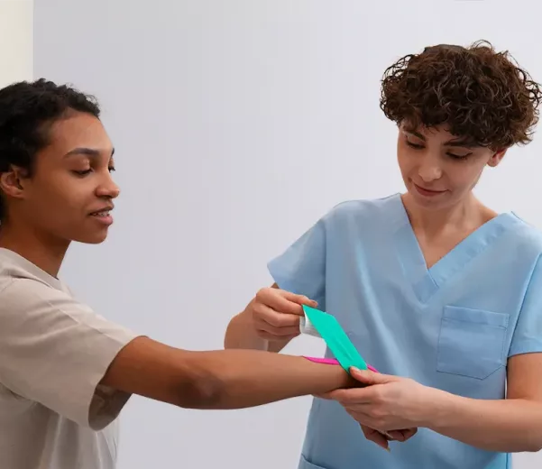Patient and nurse with custom patient board in emergency department