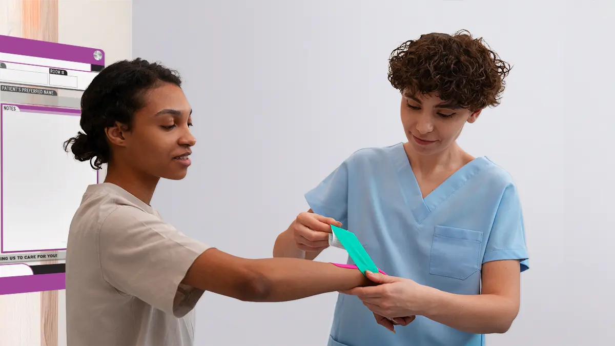 Patient and nurse with custom patient board in emergency department