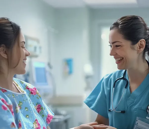 Nurse and patient in hospital room with custom oncology patient board
