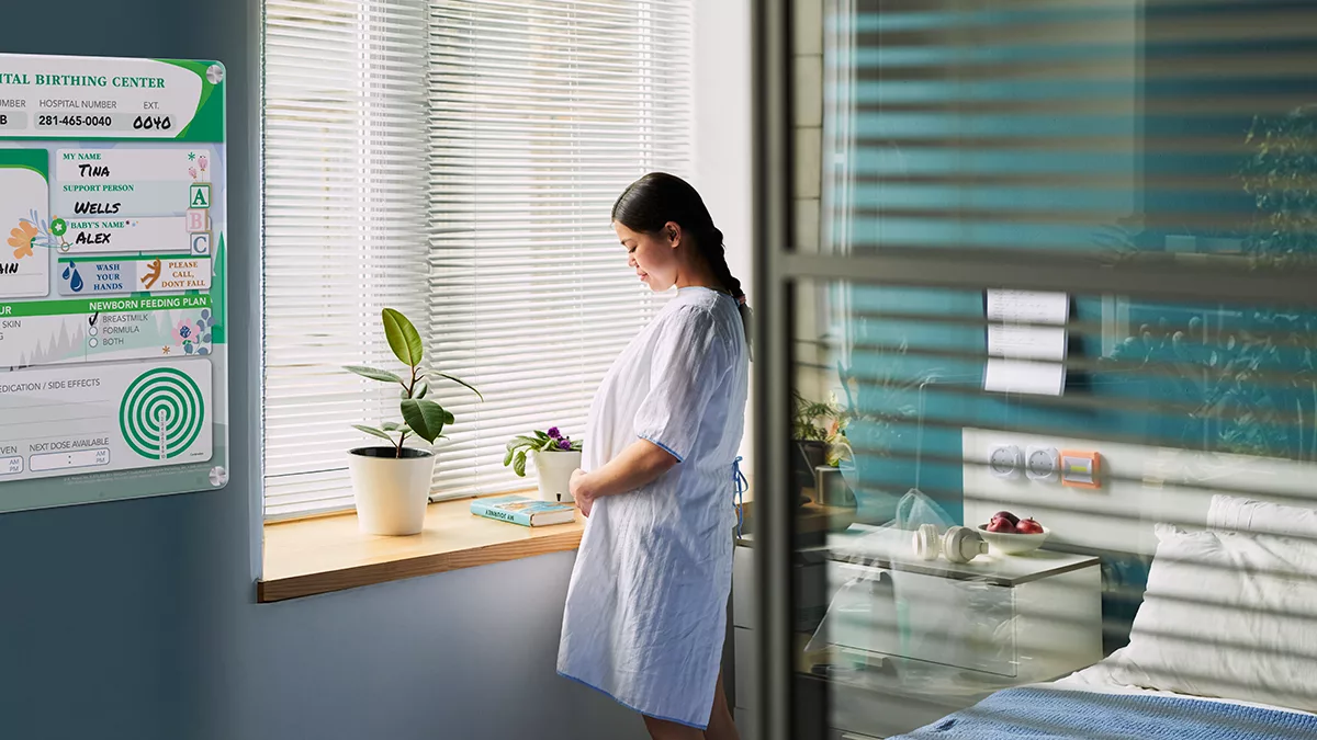 Mother in family birthing unit with custom dry erase Glass Hybrid Board Style