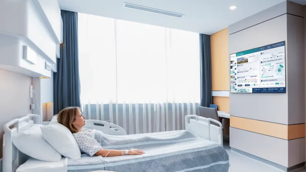 patient in hospital bed at high tech hospital with custom electronic patient boards