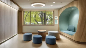 healthcare facility behavioral space with safety board signage for capacity and visitor times